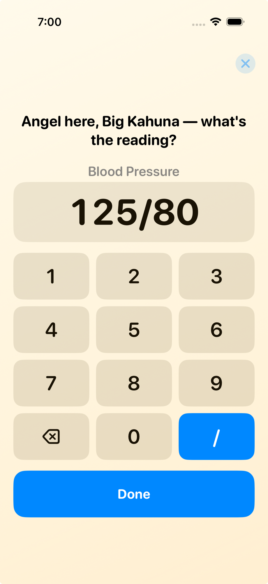 Blood pressure check-in with a large keypad showing a 125/80 reading and a slash key